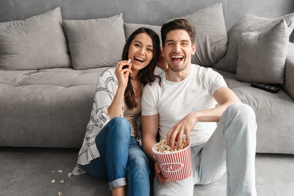 snacking as a couple in front of the TV