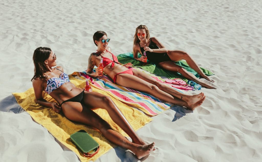 women sunbathing